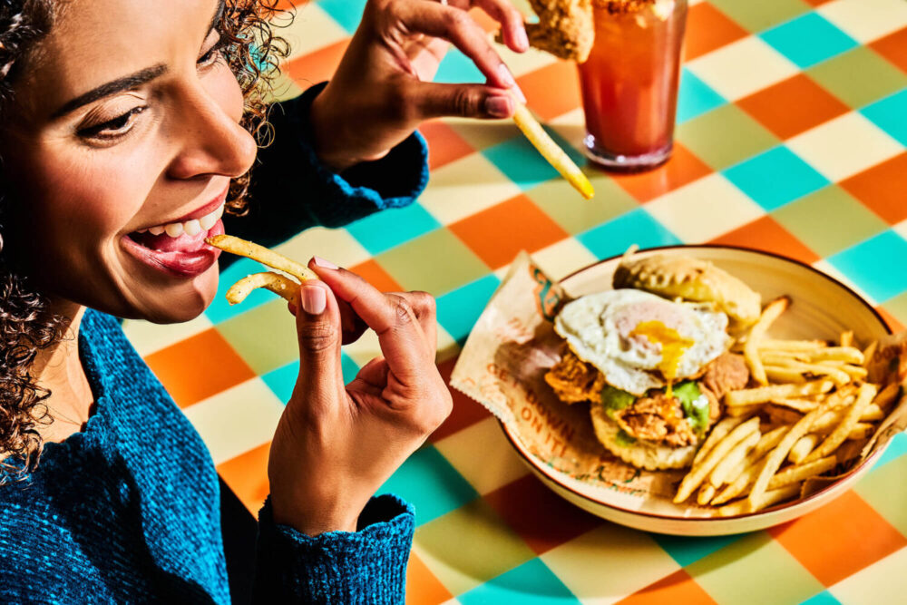 Laney's Get Down Patron eating fries